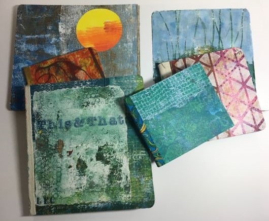 Six different board book covers created with pattern mono-prints, binding made from fabric salvage edges.