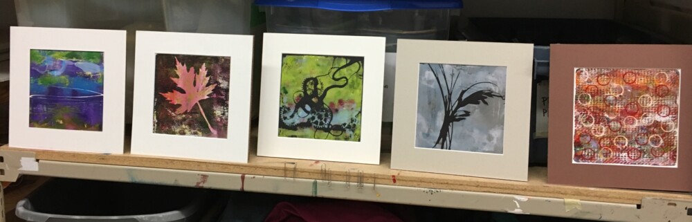 Five matted mono-prints made from leaves, string and grasses.